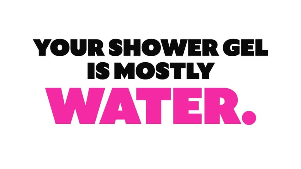 900.care film frame saying that shower gel is mostly water in bold black and pink type